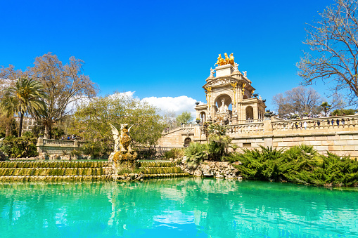Barcelona, Spain - March 26, 2023: Fountain Cascada Monumental with arch and sculptural group Quadriga de l'Aurora in the The Parc de la Ciutadella