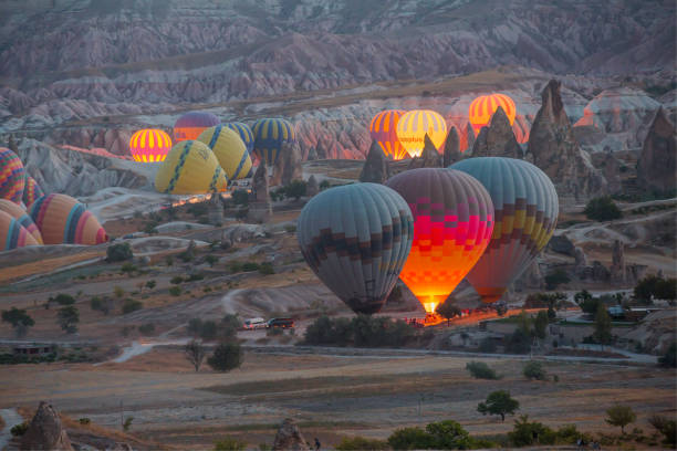 istock Hot air balloon flying over spectacular Cappadocia 1496448768