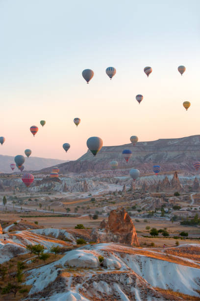 istock Hot air balloon flying over spectacular Cappadocia 1496449380