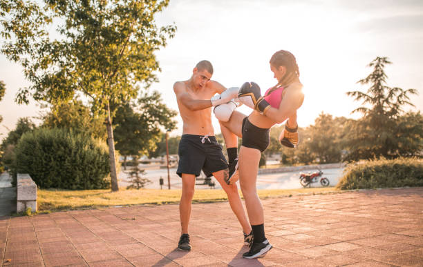 istock Two fighters in love training kickboxing in the park on sunny day 1496450368