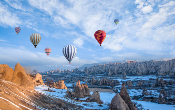 istock Hot air balloon flying over spectacular Cappadocia 1496450475
