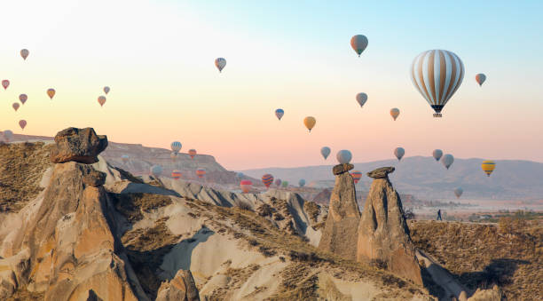 istock Hot air balloon flying over spectacular Cappadocia 1496452142
