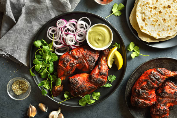 istock Tandoori chicken served with cilantro and onion 1496454292