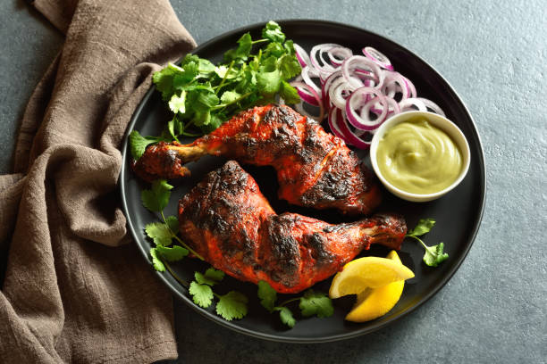 istock Tandoori chicken served with cilantro and onion 1496454294