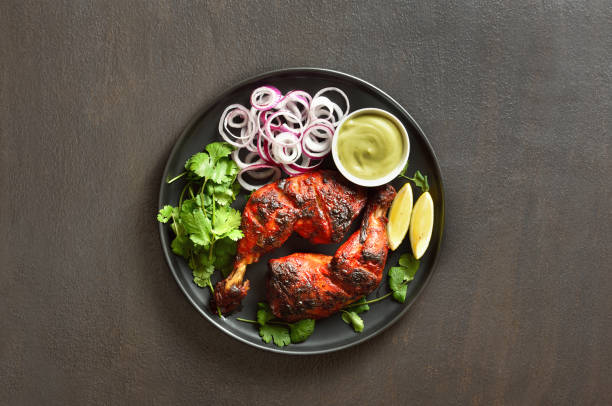 istock Tandoori chicken served with cilantro and onion 1496454298