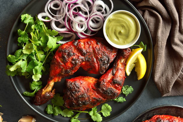 istock Tandoori chicken served with cilantro and onion 1496454699