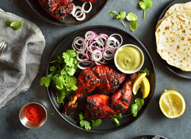 istock Tandoori chicken served with cilantro and onion 1496454820