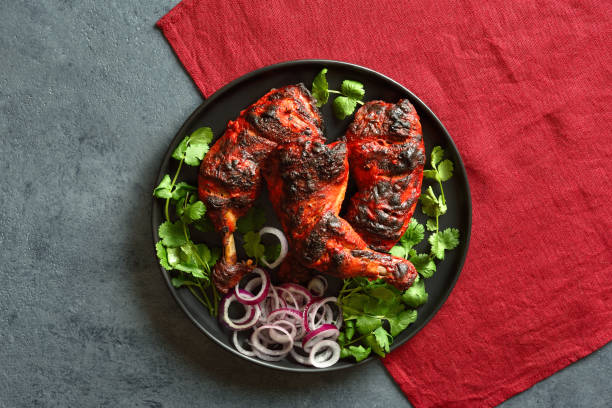 istock Tandoori chicken served with cilantro and onion 1496454859