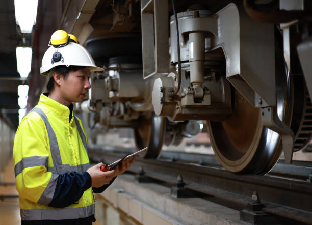 istock Railway experts are investigating foundation below the train and drive wheel system 1496457692