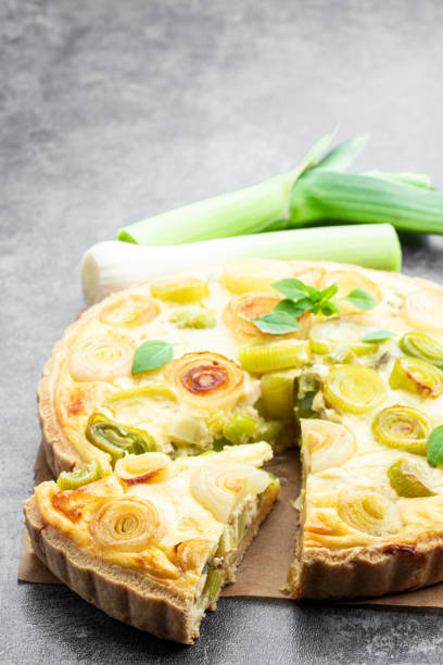 istock Quiche with leek and cheese on gray background 1496463242
