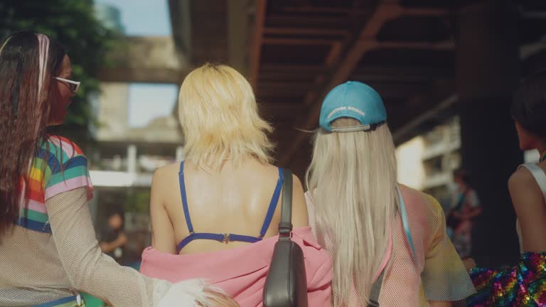 Group of friends having fun in the street LGBTQ pride parade  in Bangkok.