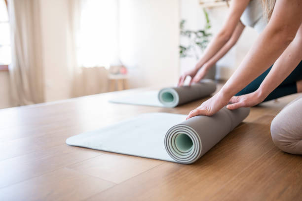istock Women exercise yoga together. 1496463735