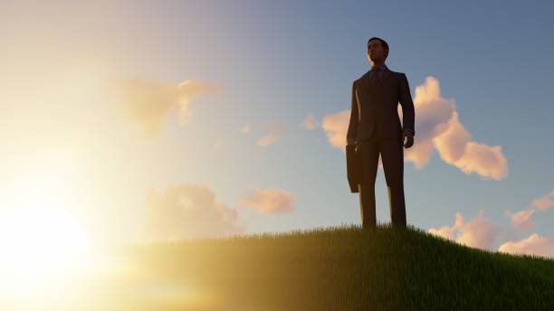 istock Happy Businessman outdoors on a grassy hill 1496464810