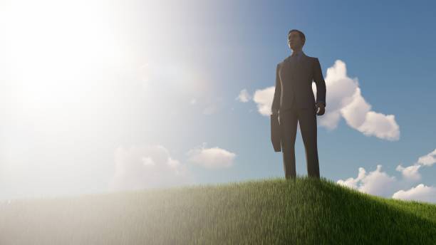 istock Happy Businessman outdoors on a grassy hill 1496464846