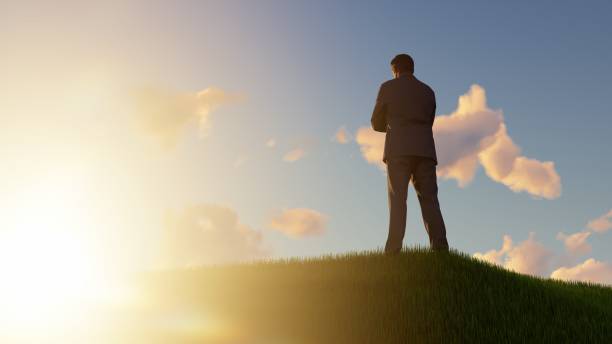istock Happy Businessman outdoors on a grassy hill 1496465012