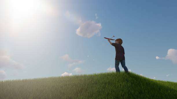 istock boys play outdoors launching toy planes, summer concept 1496465094