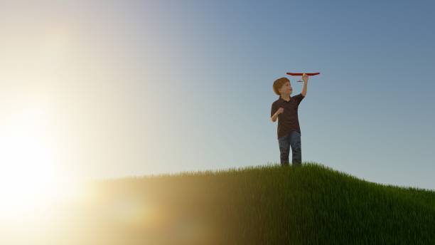istock boys play outdoors launching toy planes, summer concept 1496465099
