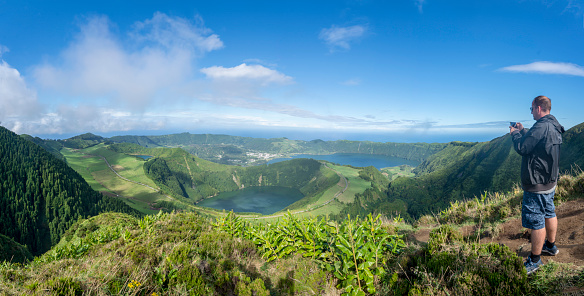 One men at the viewpoint around the caldera on São Miguel island in the Azores
