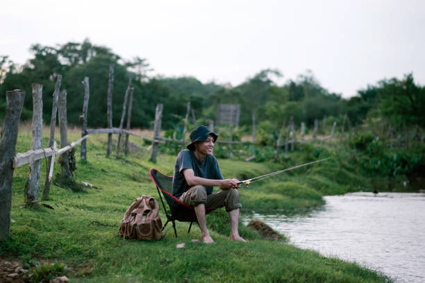 istock Asian man enjoying the nature by himself. 1496471172