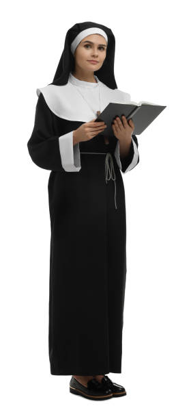 istock Young nun with Bible on white background 1496473470