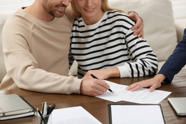 istock Notary working with couple in office, closeup 1496473568