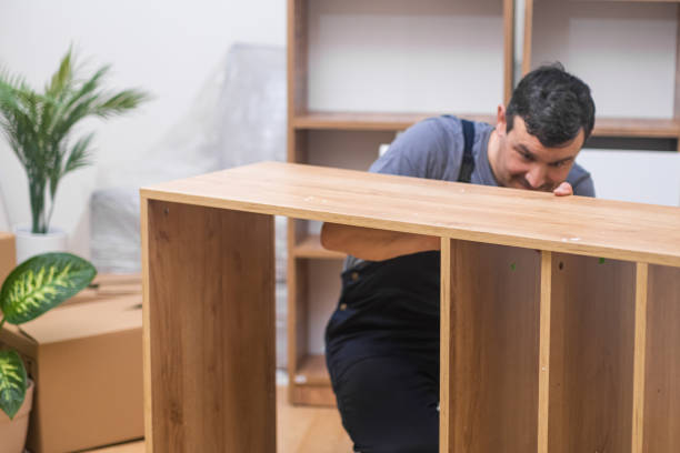 istock Furniture delivery services focused carpenter checking wooden planks 1496474437