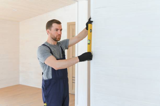 istock Builder on construction site. Manufactured Home News, modular home, conventional housing. Builder front of american house. 1496477301