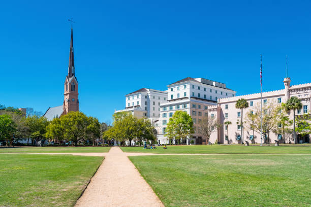 People relax in Marion Square in downtown Charleston, South Carolina, USA on a sunny day.