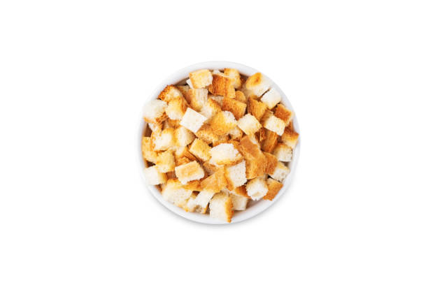 istock Croutons in a bowl on a white isolated background 1496483901