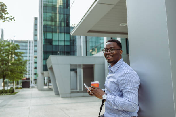istock African American businessman using smart phone after work 1496484437