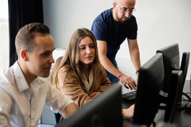istock College students with teacher in technology classroom. 1496485531