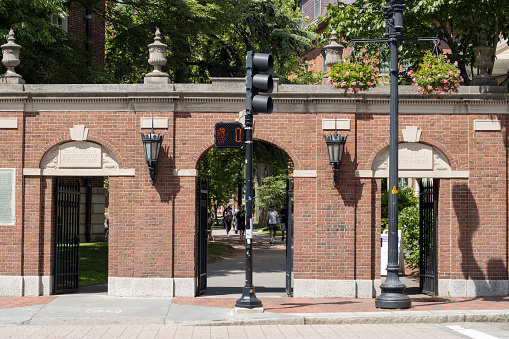 Cambridge, MA, USA - June 29, 2022: The Class of 1857 Gate (Wadsworth Gate) to the Harvard Yard, the oldest part of the Harvard University campus, in Cambridge, Massachusetts.