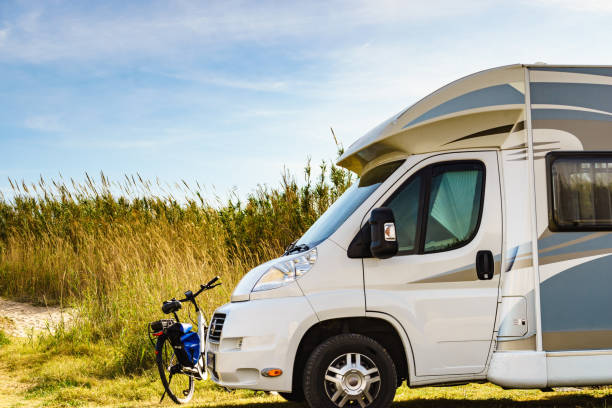 istock Camper and bicycle camping on nature 1496492572