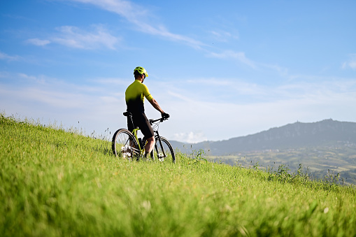 Cycling in mountains with panoramic view.