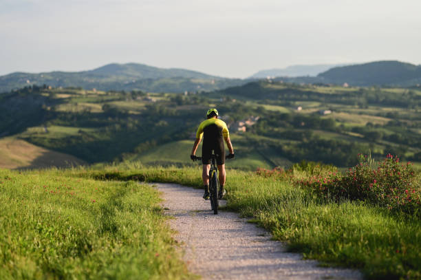 istock Cycling in mountains. Biker riding scenic path. 1496492705