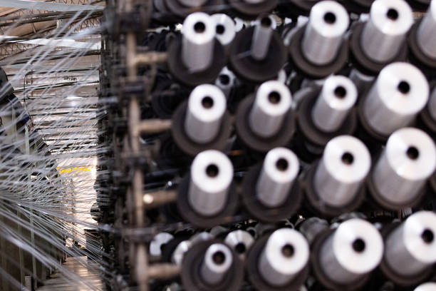 istock Manufacture of coils of polyester threads 1496494803