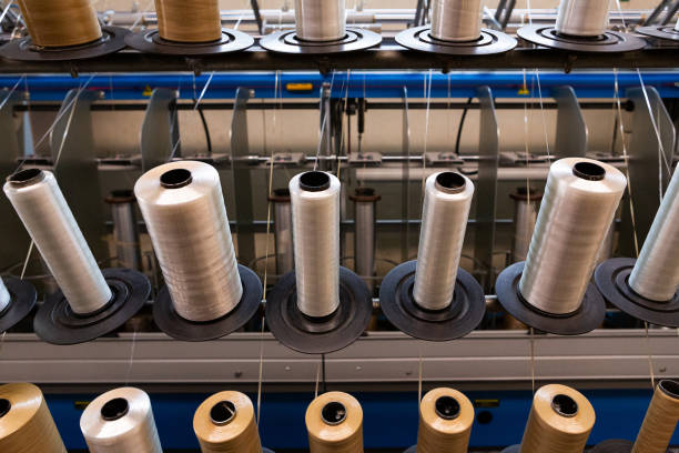 istock Manufacture of coils of polyester threads 1496495452