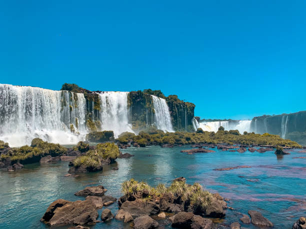 Waterfalls of Foz do Iguaçu Waterfalls of Foz do Iguaçu, crystalline water, big falls, vegetation, blue sky foz do iguaçu stock pictures, royalty-free photos & images