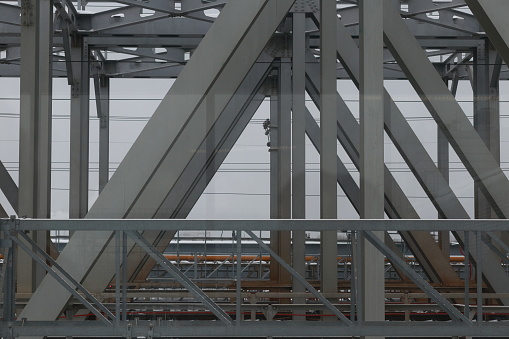 Frame and beams of a steel bridge. Construction closeup.