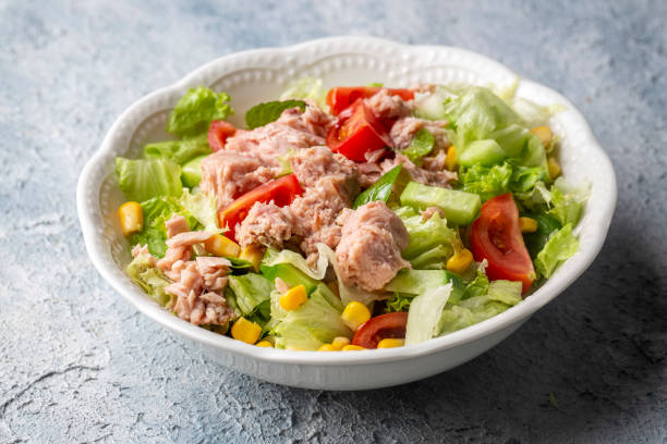 istock Tuna Fish Salad with Lettuce, Cherry Tomatoes, Cucumber and Corn. 1496500772