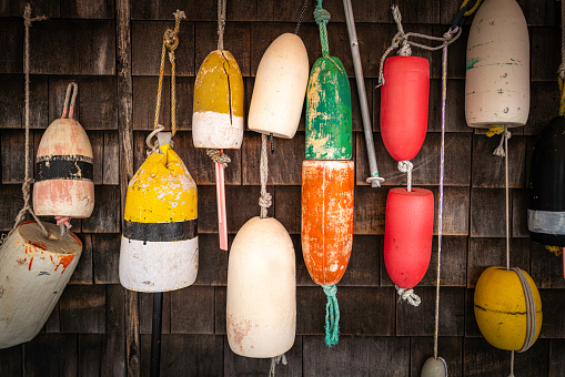 Fishing buoys hanging on the dock wall