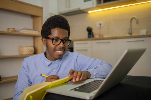 istock Young fashionable man working at home 1496507928