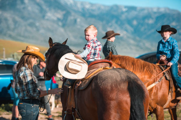 istock Youngest Cowboy Riding A Horse 1496510029