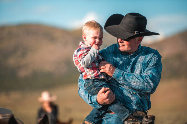 istock Loving Caucasian Father Holding Baby on Arms 1496510044