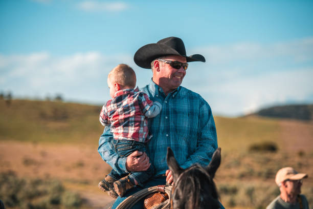 istock Happy White Father Holding Baby Boy on Arms 1496510051