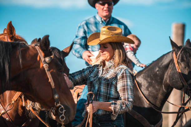 istock Good Looking Woman Next to Horse 1496510067