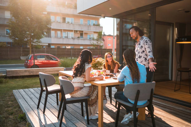 istock Cool Multiracial People Drinking And Eating Outdoors On A Terrace 1496511613