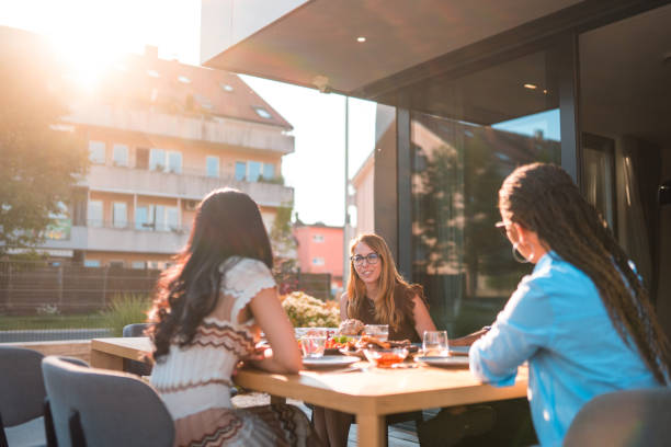 istock Asian, Black And Caucasian Women Talking On A Terrace 1496511631