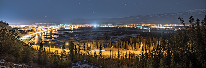 Panoramic views in northern Canadian Klondike gold rush town during fall with lights shining bright