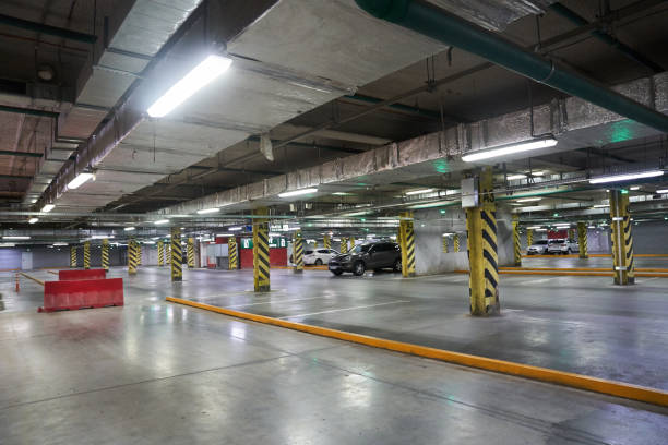 istock Selective focus of underground parking in a shopping mall. Parking restrictions. With a space to copy. Navigation in the parking lot. Free parking space. High quality photo 1496514830